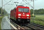 185 211-0 DB als Tfzf kommt während eines kräftigen Gewitterschauers vor dem Halt zeigenden Signal des Hp Zscherben auf der Bahnstrecke Halle–Hann.