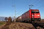 Durchfahrt am 07.12.2013 von der Mannheimer 185 279-7 mit einem gemischten Güterzug in Müllheim (Baden) gen Basel.