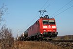 Mit einem gemischten Güterzug fuhr am 07.02.2015 die 185 091-6 bei Hügelheim in Richtung Schweizer Grenze.