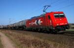 Alpha Trains Belgium 185 605, vermietet an HKG (2063), mit Kesselwagenzug in Richtung Süden zwischen Vehrte und Belm, 27.03.11