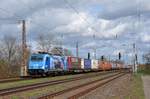 Mit einem KLV-Zug passiert 186 941 der LTE am 13.04.21 Saarmund Richtung Potsdam.