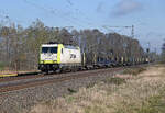 186 155 der Captrain schleppte am 10.04.26 einen leeren Rungenwagenzug durch J�trichau Richtung Magdeburg.