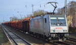 Die polnische LOTOS mit Rpool Lok E 186 274-7 (NVR-Number: 91 80 6186 274-7 D-Rpool]  und einem Stammholz-Transportzug am 19.02.18 Berlin-Hirschgarten.