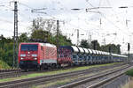 189 004-5 fährt mit einer langen Schlange neuer Facnps durch Saarmund in Richtung Westen.

Saarmund 28.09.2024