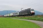Am 6.September 2013 war MRCE ES64F4 038 mit TXL 185 540  Kassel Huskies  als Wagenlok und einem Brenner-Umleiter bei Bernau am Chiemsee auf dem Weg Richtung Mnchen.