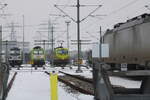 ATLU 193 558 am 17.02.2026 in der in der HPA Lokservicestelle im Bahnhofsteil Hamburg Alte Süderelbe. Durch den Zaun fotografiert.
