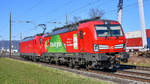 193 309 wird von 185 136-9 bei Frenkendorf BL (CH) in Richtung Basel geschleppt, aufgenommen am 21.02.2021.
