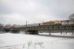 103 245 am 04.12.10 mit DZ 13087 nach Innsbruck auf der Braunauerbrcke in Mnchen