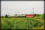 211 030 mit dem  Störtebeker Express  nach Binz, am 23.07.2016 in Bitterfeld.