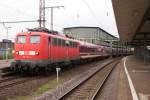 110 210-2 mit einem Pilgersonderzug nach Lourdes in Duisburg Hbf am 08.05.2010