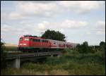 110 416-5 berquerte am Nachmittag des 25.07.2008 mit ihrer RB von Donauwrth nach Aalen eine Brcke kurz vor ihrem nchten Halt in Trochtelfingen.