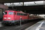 Die Stuttgarter 110 418-1 schiebt den RE1 Verstrker ab Dsseldorf HBF nach Kln am 19.10.2011