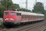 Die 110 429-8 zieht ihren RB35 Verstrker von Kln nach Wesel durch Duisburg Rahm am 26.07.2011