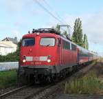 110 490-0+BTE BahnTouristikExpress als DZ2860/2681 Warnemnde-Berlin-Postdam-Warnemnde bei der Durchfahrt im Bahnhof Rostock-Holbeinplatz.16.08.2011