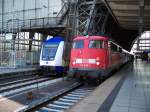 Metronom und Br 110 506 stehen gemeinsam im Bremer Hbf (25.7.2007)