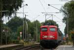 RB 14823 (Oldenburg(Oldb)-Bremen Hbf) mit Schublok 110 487-6 bei der Abfahrt Heidkrug 20.8.