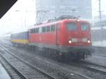 110 209 mit NL Wagen im Wolkenbruch.Essen Hbf.(19.07.2008)