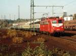 110 126-0 mit eine farbenfrohe Nahverkehrszug 8844 Duisburg-Kln Deutz auf Bahnhof Herzogenrath am 29-10-1993.