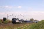 110 511 befördert am 11.04.2014 einen BLG-Autozug westwärts. Aufgenommen nahe des Abzweigs Zeithain