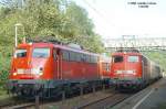 Zugbegegnung auf der eingleisigen Strecke Backnang - Marbach von 110 425-6 und 110 408-2 mit Zwei-Wagen-RB am 18.08.2004 im Bahnhof Kirchberg a.d.Murr.