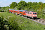 BR  111 197 in Schweinchen Rosa mit einem Regionalexpress nach M�nchen am 9 Mai 2026 bei Feldmoching.
