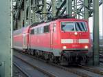 BR 111 111-1 berquert den Rhein in Kln ber die Hohenzollernbrcke mit einem RE in Richtung Kln Messe/Deutz.