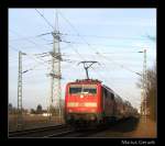 RE 10429 mit Schublok 111 127 nach Dortmund an der ehem. Anrufschranke Geilenkirchen