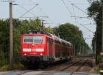 111 135-0 mit der RB 14822 (Bremen Hbf-Emden Hbf) bei der Einfahrt Heidkrug 20.8.09