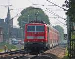 RE10415 aus Aachen nach Dortmund mit Schublok 111 119 bei Km 29.0 zwischen Geilenkirchen und Lindern, 22.5.10