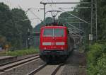 RB11184  Fuball-Sonderzug  aus Aachen nach Essen Stadtwald mit Schublok 111 155 bei der Durchfahrt in Lindern, 15.8.10