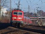 Der RE9 im 111er Sandwich am 29.01.2011 auf der KBS 480 bei Aachen Rothe Erde. Vorne zieht 111 016 und von hinten schiebt 111 075-8.