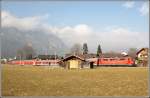 Regionalbahn von Mnchen Hbf hat gerade den Bahnhof Garmisch- Partenkirchen nach Mittenwald mit Zuglok 111. Im Vordergrund ein paar verlassene Huschen. (19.02.2011)