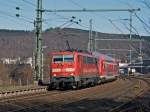 111 075-8 zieht den Rhein-Sieg-Express (RE 9) am 20.03.2011 in Betzdorf-Scheuerfeld von Siegen ber Kln nach Aachen.