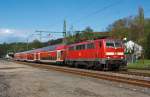 111 011-3 rauscht mit dem RE 9 (Rhein-Sieg-Express) Aachen - Kln - Siegen in Richtung Siegen vorbei,  hier am 30.04.2012 in Mudersbach.