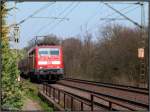 Die 111 128 mit dem RE 4 am Haken ,unterwegs nach Aachen.Mrz 2012 bei Herzogenrath.