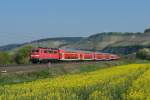 111 182 mit einem RE nach Wrzburg Hbf am 19.04.2011 unterwegs bei Himmelstadt.