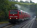 Auch E-Lok´s knnen dampfen! Bei strmenden Regen fhrt am 31.08.2012 RE9 als Sandwich (111 010 und 111 077-4) auf der KBS 480 bei Eilendorf.