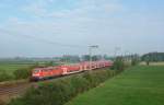 111 085-7 fuhr am 08.09.2012 mit einem RE von Emden nach Mnster, hier bei Veenhusen.