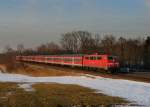 111 034 mit einem RE nach Salzburg am 21.02.2012 bei Hilperting.