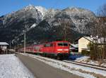 Die 111 166 mit einer RB nach Mittenwald am 08.12.2013 unterwegs bei Garmisch-Partenkirchen.
