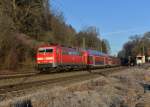 111 180 mit einem RE nach Salzburg am 14.12.2013 bei der Durchfahrt in Assling.