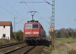 Einen RE7 schiebt 111 147-5 nach Krefeld Hbf.