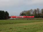 Eine 111 mit einem RE nach Salzburg am 21.04.2013 unterwegs bei Stephanskirchen.