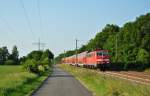 111 145-9 fuhr am 12.06.2015 mit einem RE von Emden nach Münster, hier bei Völlenerfehn.