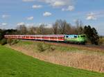 Die 111 039 mit einem RE am 19.04.2012 unterwegs bei Rosenheim.