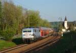 111 031 mit einem RE nach Nrnberg am 23.04.2011 unterwegs bei Hausbach. 