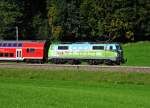 Elektrolokomotive 111 039-4 der Deutschen Bahn AG   im  DAV - Design vor einem Mnchen-Salzburg RE bei Haslach vor Traunstein am 09.10.12.