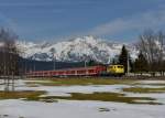 111 024 mit einem REX am 04.04.2013 bei Seefeld in Tirol.