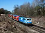 Die 111 017 mit einem RE nach Salzburg am 02.04.2011 unterwegs bei Ostermünchen.