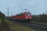Bei der Ausfahrt aus Möckmühl am Vormittag des 15.1.2023 konnte ich die 111 200-2 mit dem RE8 Ersatzzug fotografieren wie sie in den eingleisigen Abschnitt zwischen  Möckmühl und